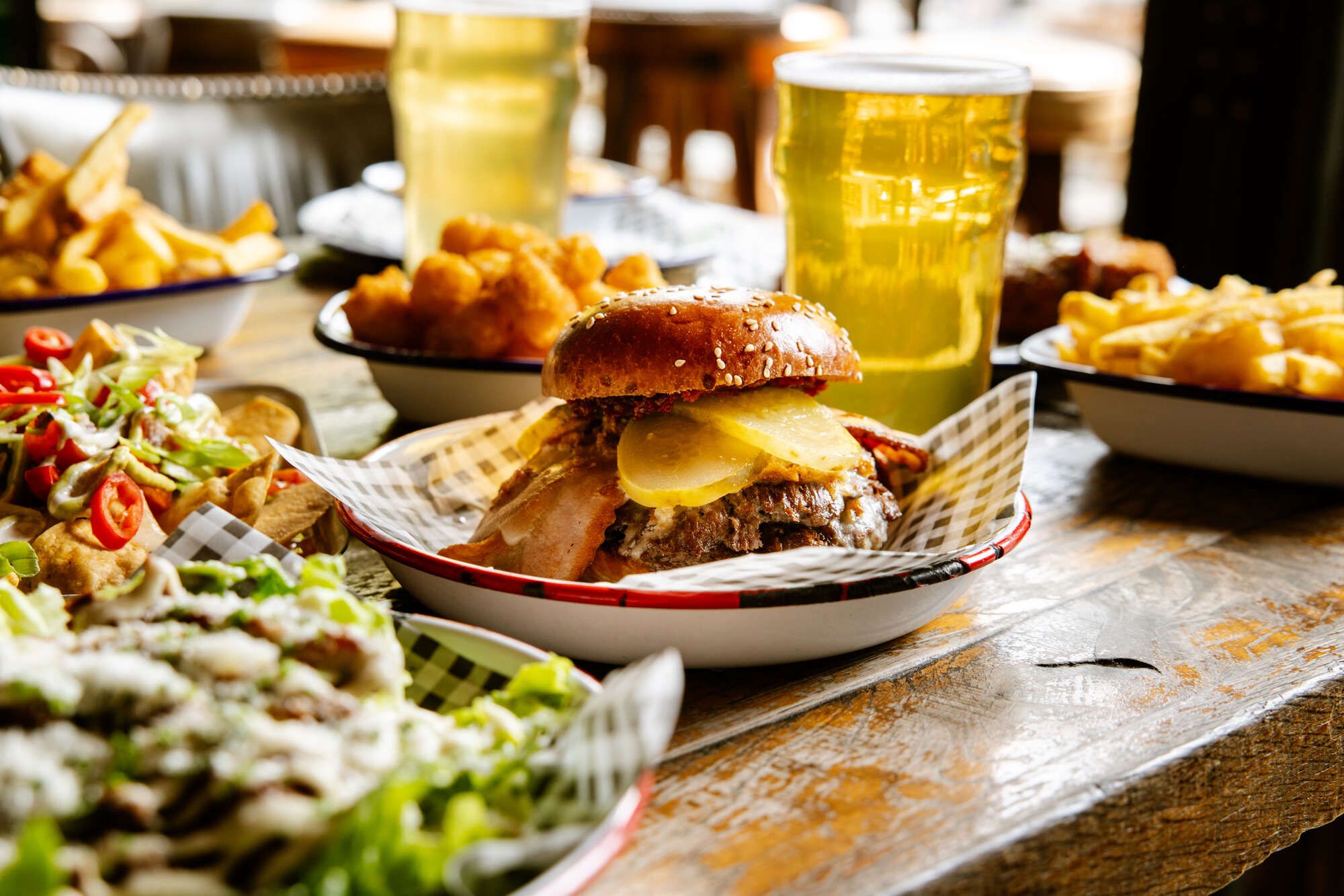 Juicy Burger with Beer in the background