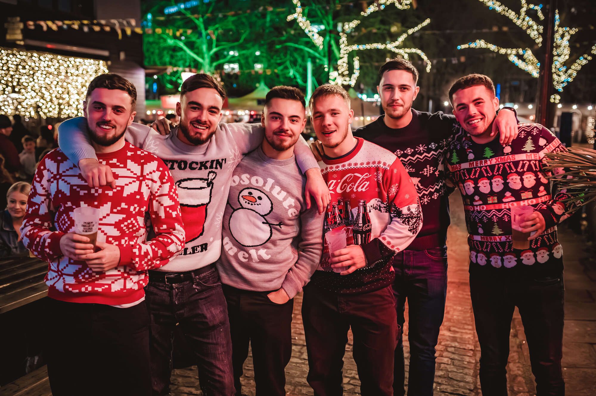 Group of guys with christmas jumpers